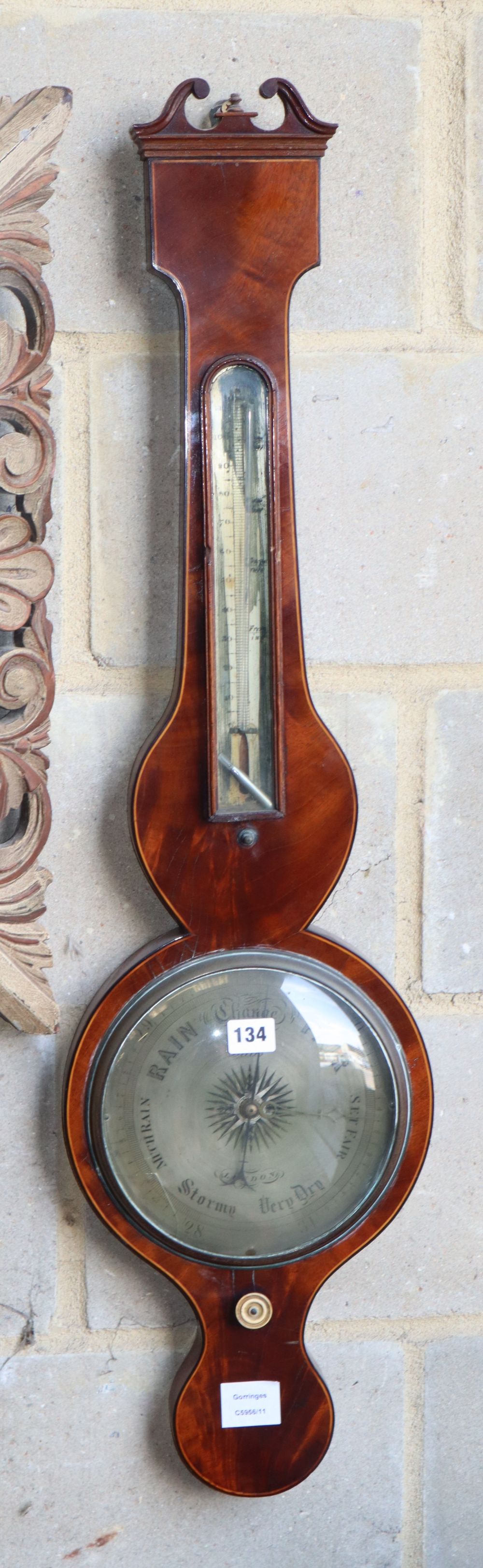 A Regency boxwood line inlaid mahogany wheel barometer by Stiles of London, H.96cm